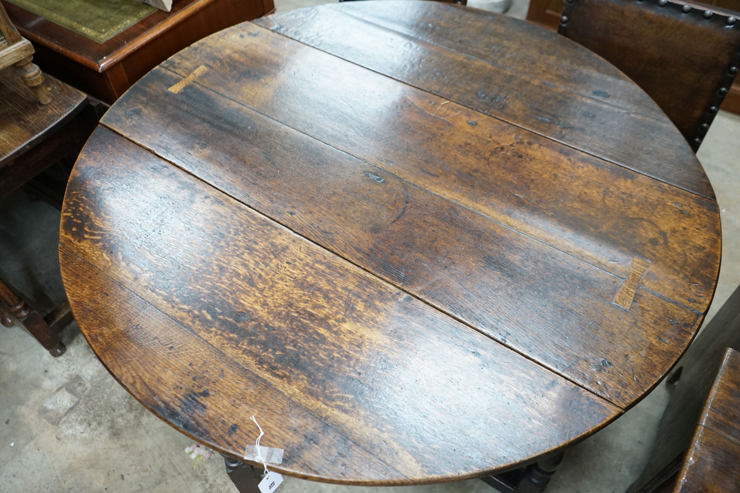 An 18th century oak gateleg table, 120cm extended, width 122cm, height 73cm